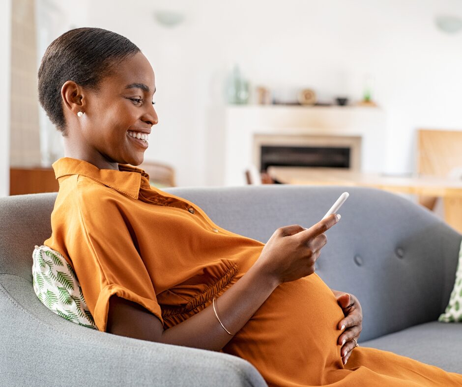 Image of pregnant women on the phone smiling